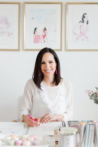 Nina Maric, Canadian fashion illustrator, at her desk working on her artwork