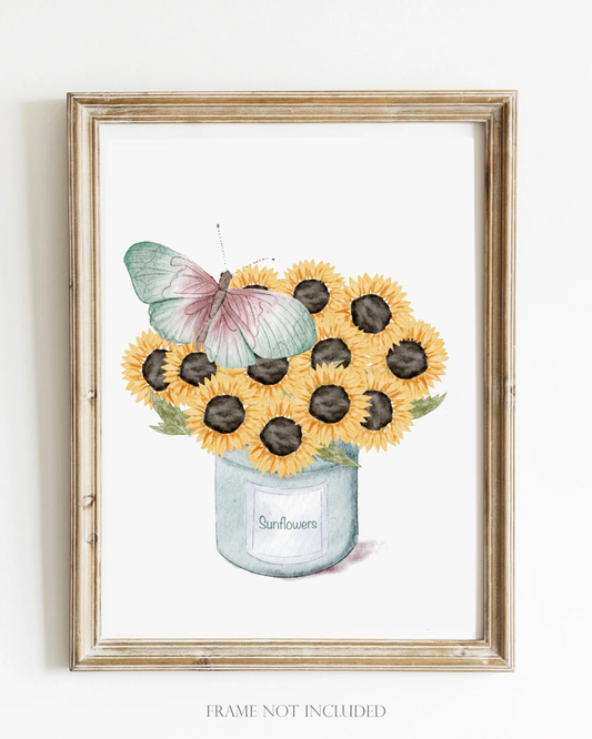 Framed artwork of sunflowers in a jar with a butterfly on a white background