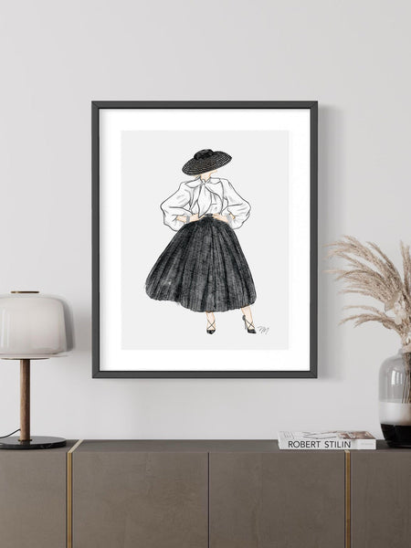 Nina Maric illustration on display featuring a woman in white blouse, black hat and black skirt